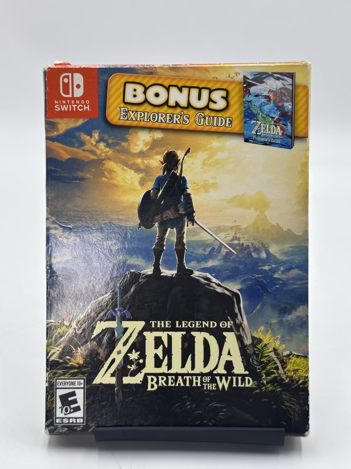 The Legend of Zelda: Breath of the Wild - com Explorer's Guide - Seminovo Completo, SWITCH, foto real da unidade