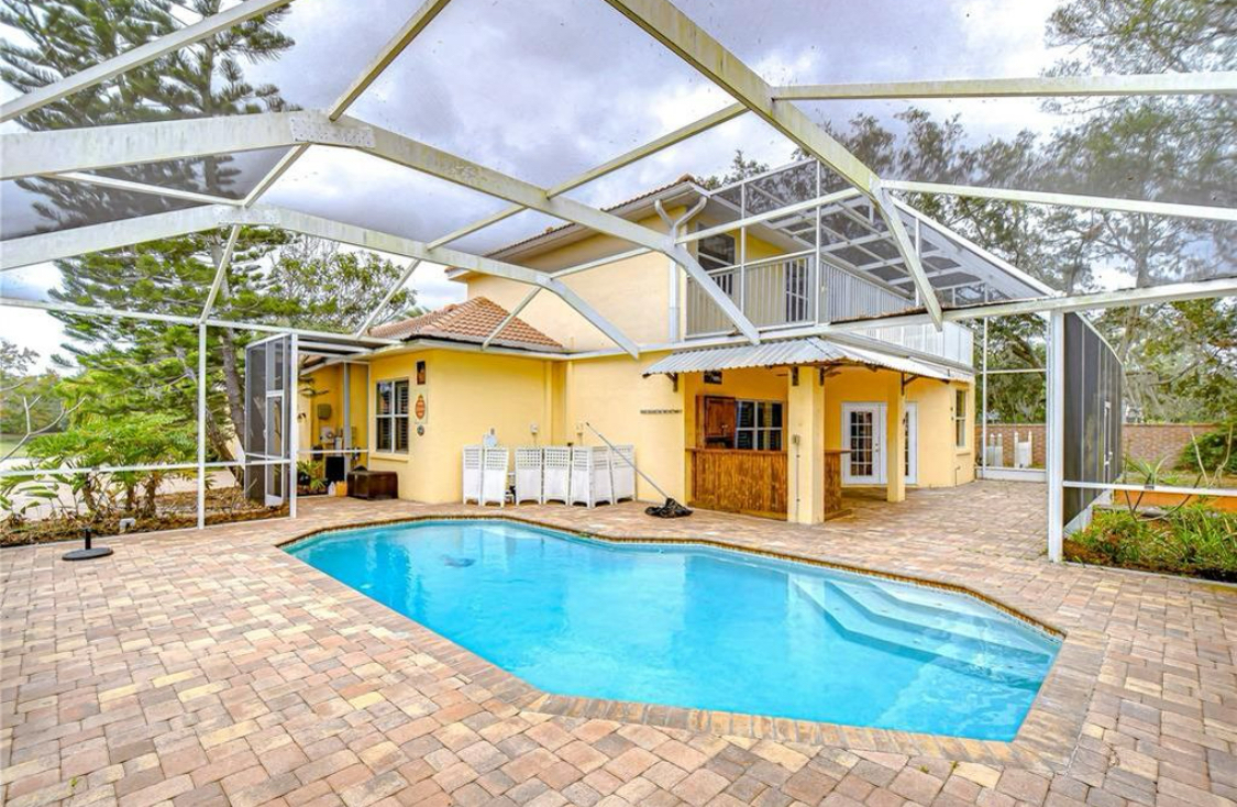 In-ground swimming pool in the backyard play area
