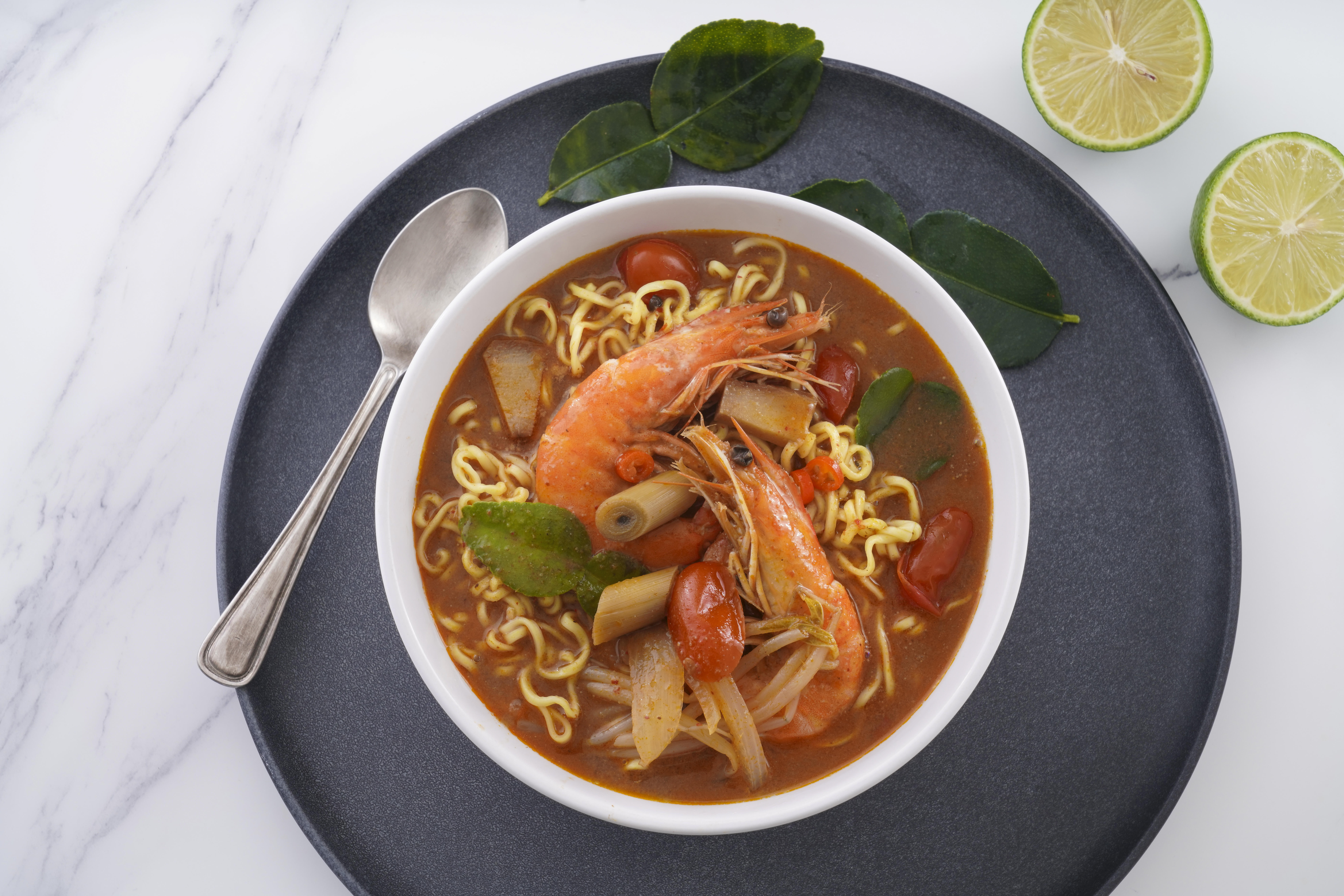 Air dried ramen noodles in spicy seafood broth representing Asian flavor enjoyed worldwide.