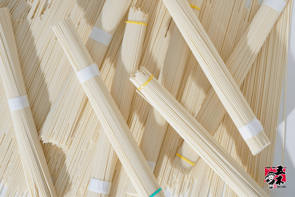 Bundles of WU-MU THIN KAN-TO Noodles arranged in rows