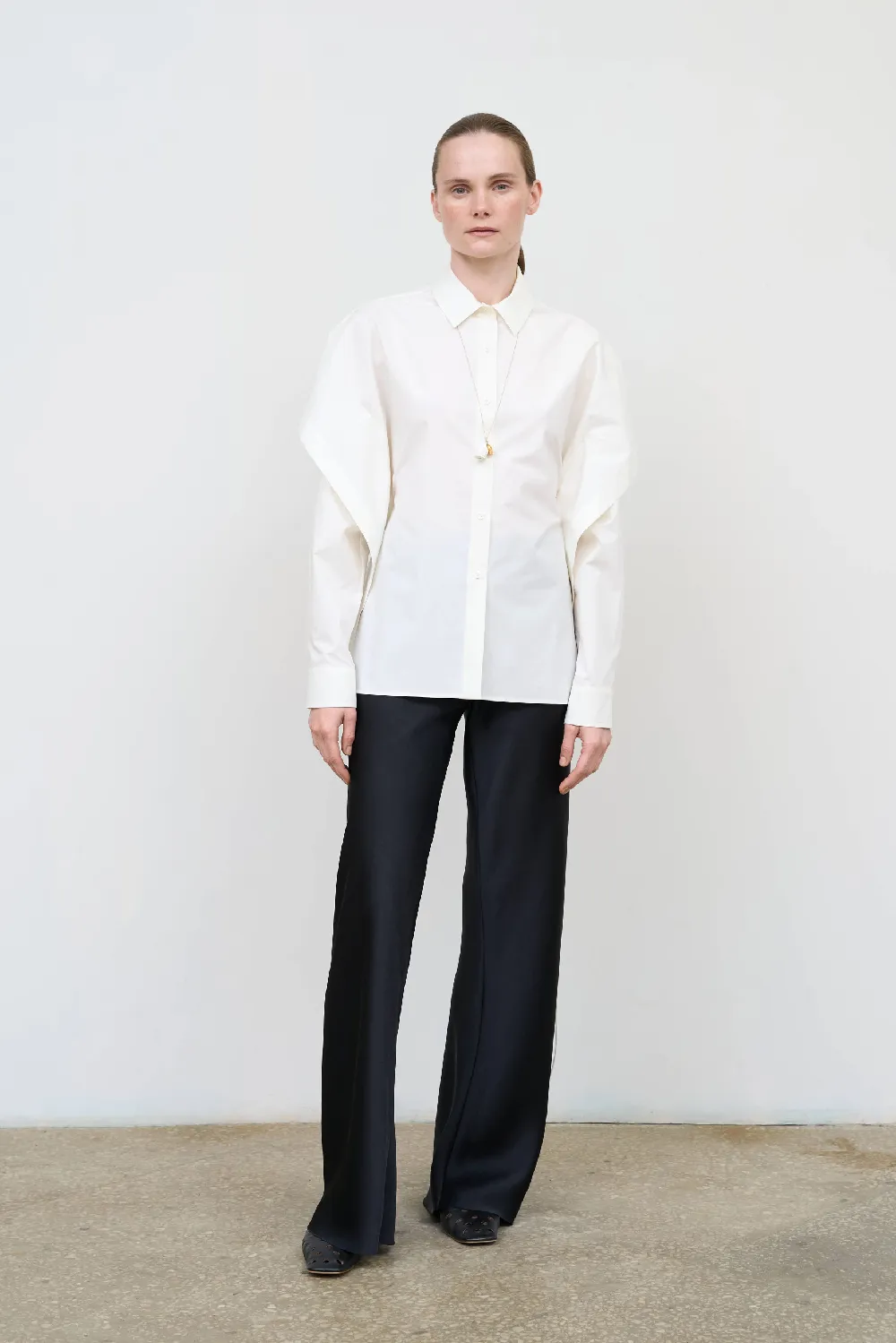 FITTED SHIRT WITH CAPELET OVERLAY AND OPEN BACK