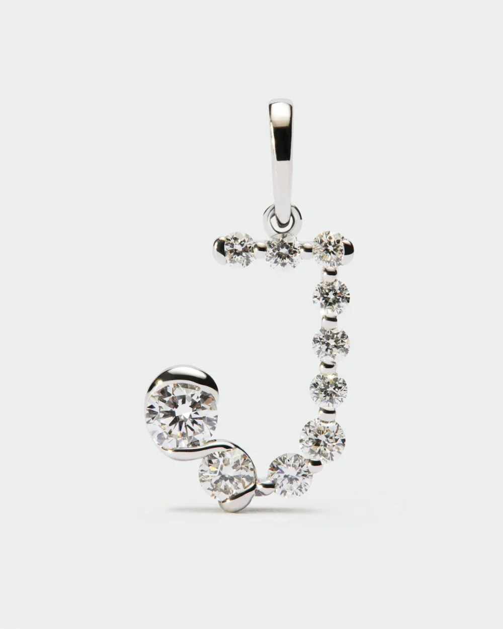 Diamonds and white gold J initial pendant