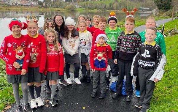 Mr McElroy's class enjoy their festive mile.  They wore festive clothes in support of children's mental health.