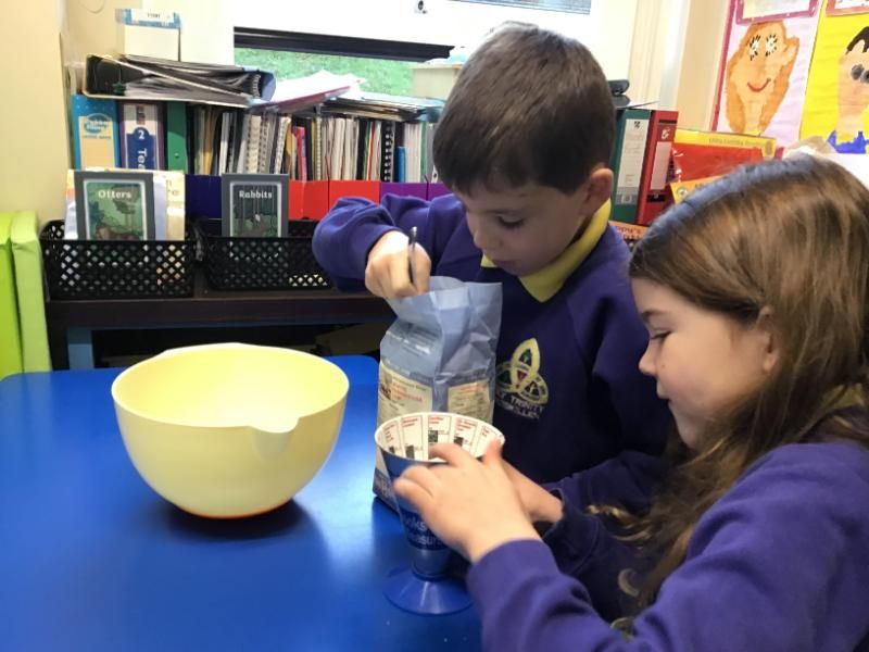 Bread making in P3: Measuring out ingredients. 