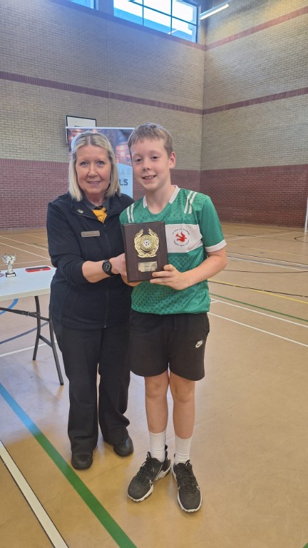 Our captain, Cillian, being presenting the Shield by the manager of McDonald's.