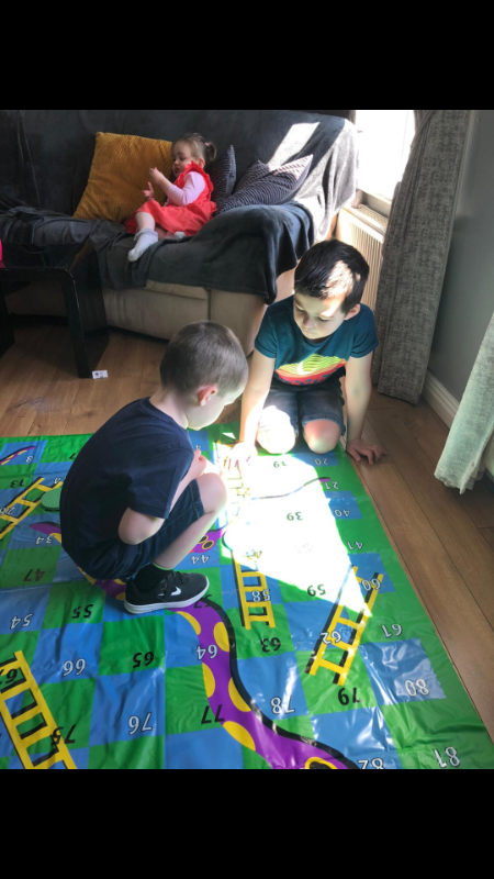 ConĂ¡ll P3 having fun with his brother Conor playing Snakes and Ladders.