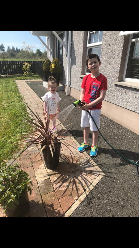 ConĂ¡ll busy teaching his little sister how to look after living things. Well Done ConĂ¡ll!