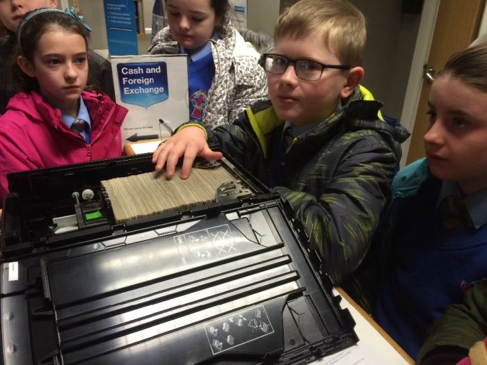 Rory Mc Girr gets to touch £30000, just before it is put into the ATM machine
