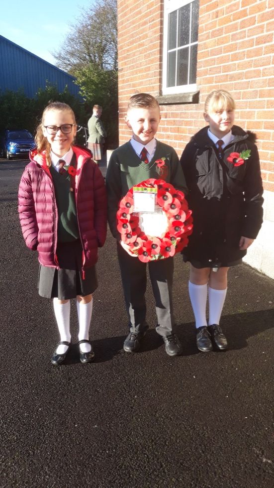 School Council members laying a wreath on Remembrance Sunday in Dromore Square