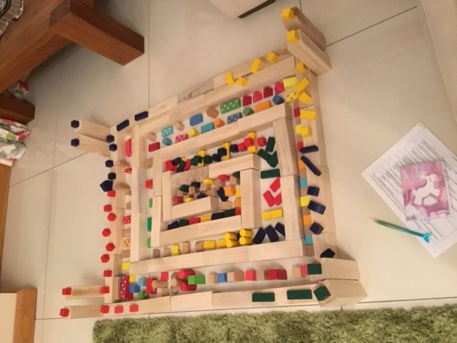 Saorla made the spiral pattern with large Jenga and building blocks.