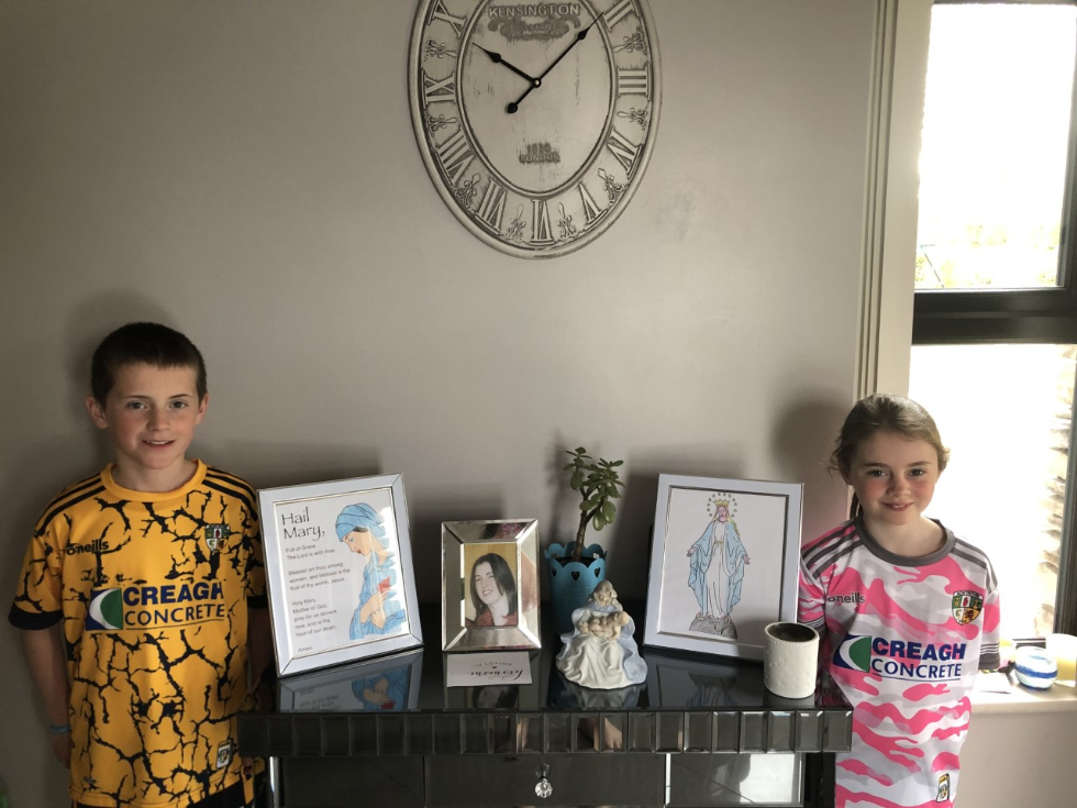 What a beautiful May altar. We love your handmade portraits of Mary. #homelearning