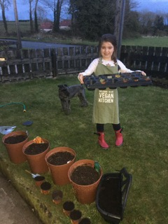 Herbs + soil + hard work + cool wellies + super apron = fresh herbs for our dinner!