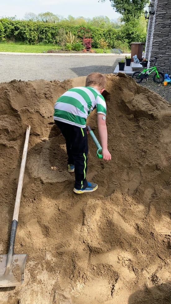 Making a beach in the garden.