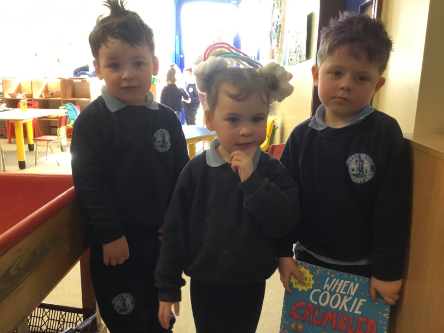 Nursery children with their new book.