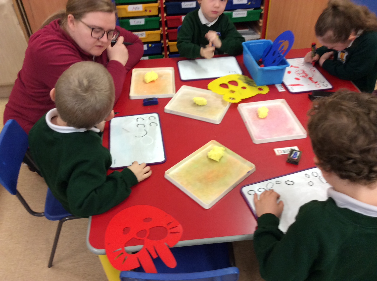 We practice our letters.