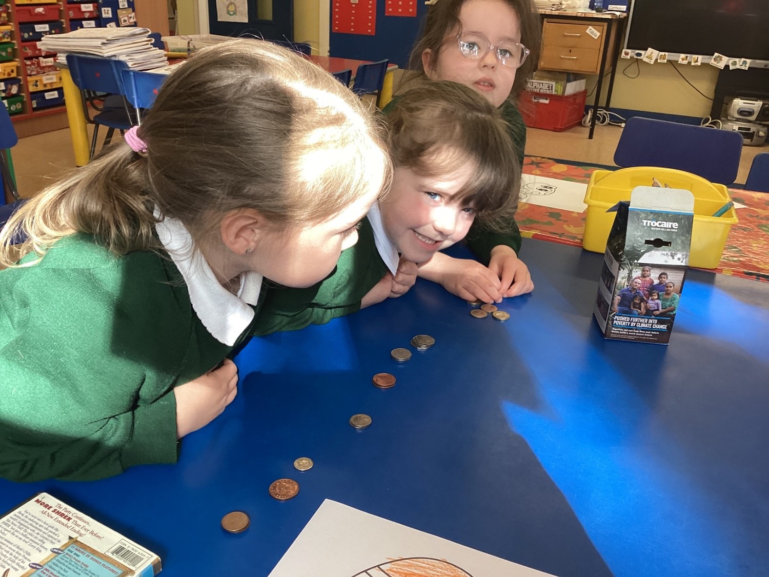 We counted out all the coins we collected for Charity.