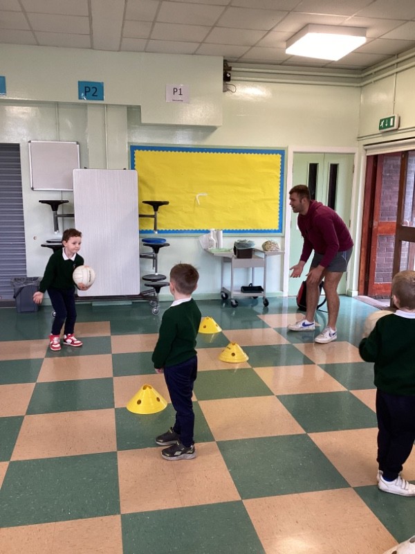 We practice throwing and catching in P.E.