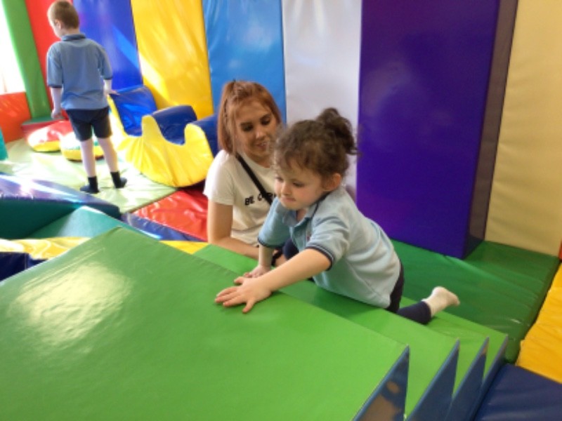 Using the steps in soft play to practice my physical skills.