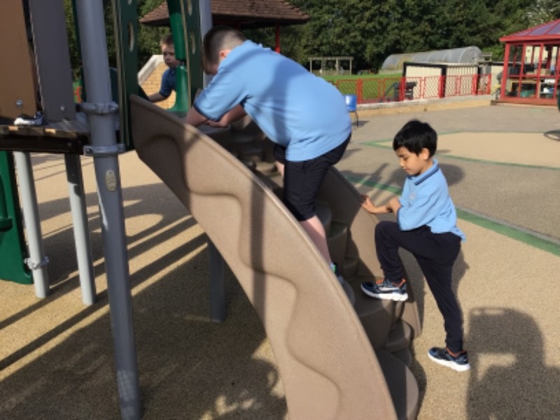 We're building core strength and stability during outdoor play, skills which help us become super writers!