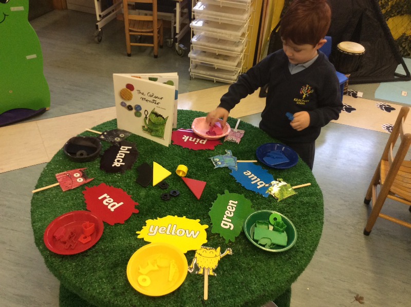 Sorting our loose parts into the correct tray.