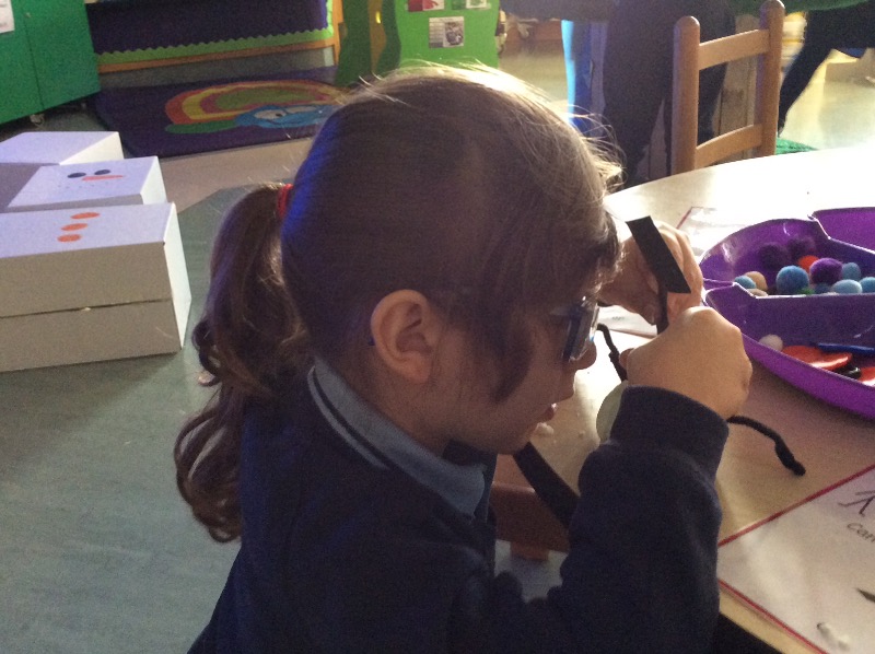 Making a snowman using cloud dough.