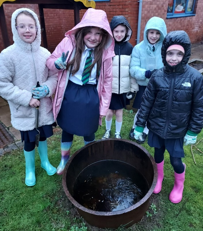 Look how much rain has collected in the 'famine pot' in the garden!