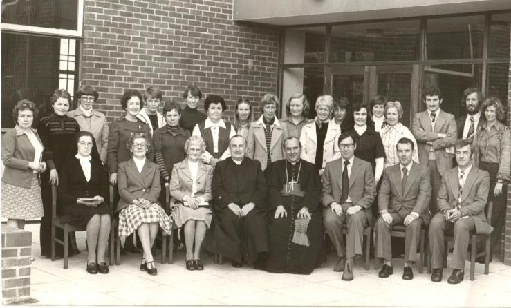 The late Canon Francis McLarnon, Parish Priest and the original staff of St. John the Baptist P.S. photographed with the late Cardinal Tomas O'Fiaich at the blessing and official opening of the school in 1975. 