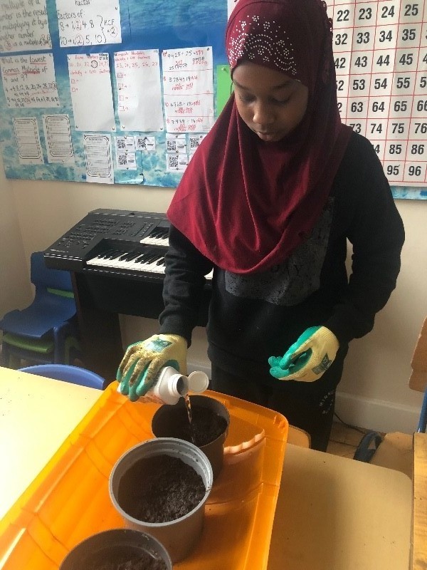 We enjoy learning how to plant bulbs for our Children's Garden area