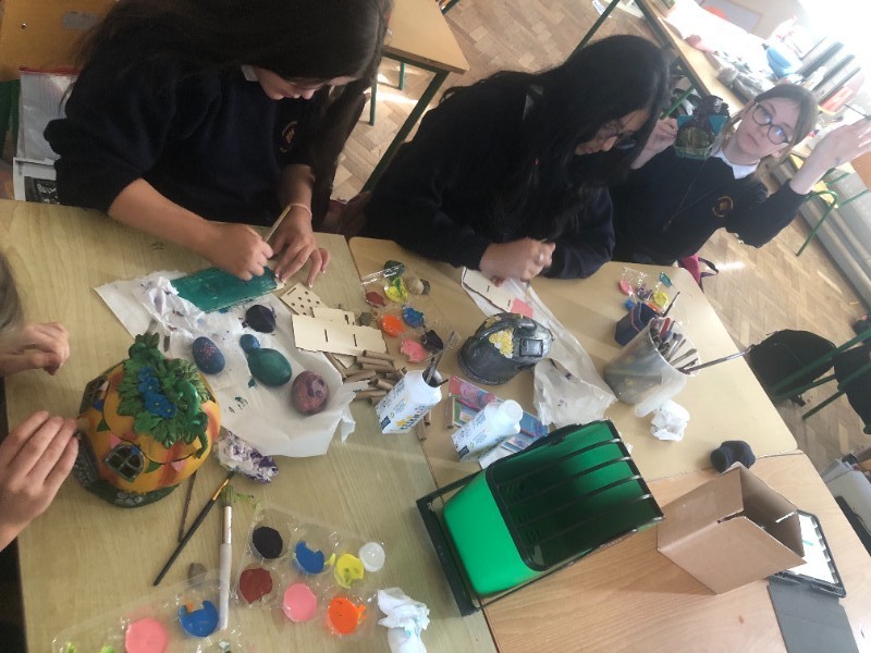 6th class busy restoring old Fairy Houses and decorating Bug Hotels the children made themselves