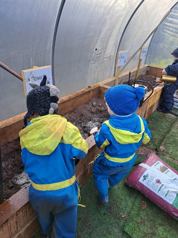 Watering cans and rakes