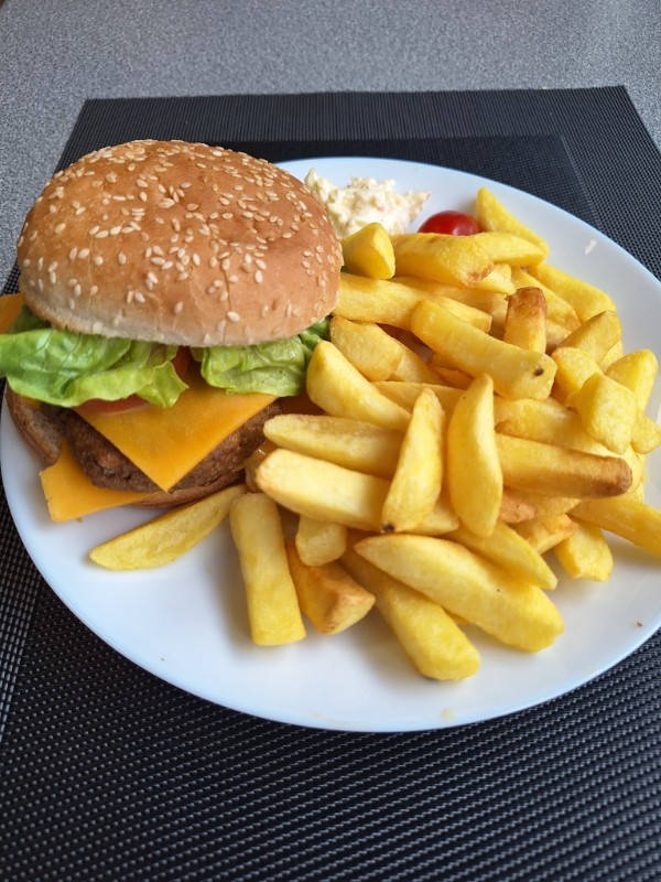 Home made beef burger, chips and side salad.