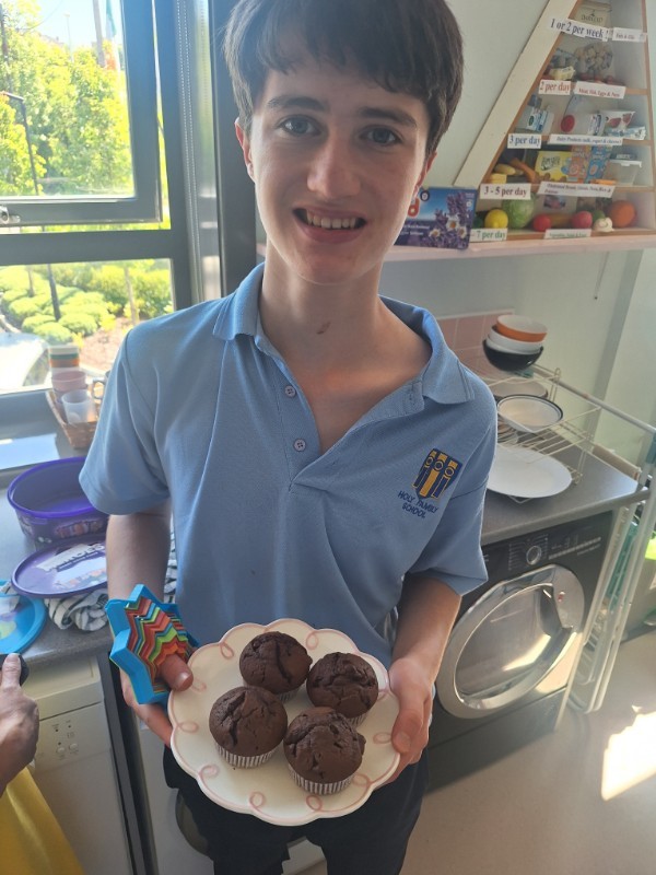 Niall is showing off his delicious chocolate chip muffins.