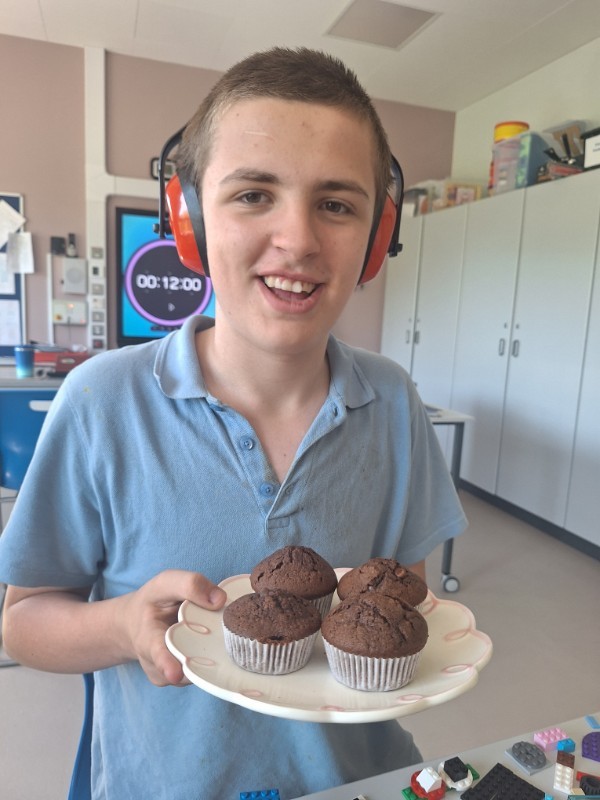 Daniel is looking forward to sharing his chocolate chip muffins.