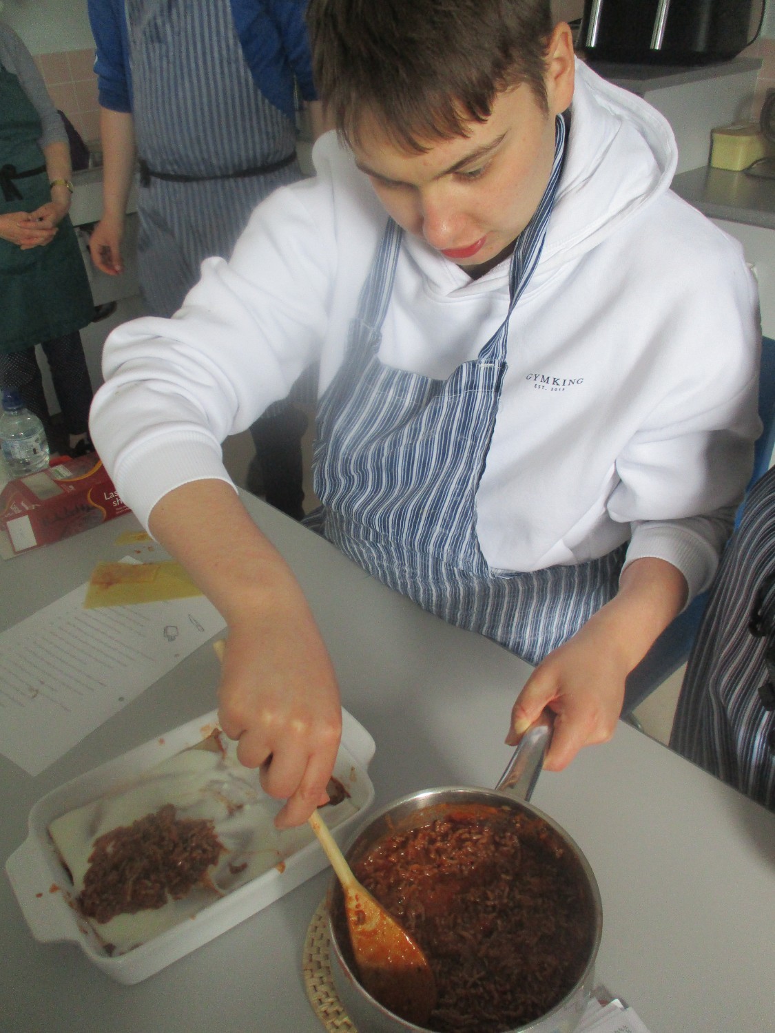 Just one more layer from Nathan, some cheese on top and it is ready for the oven!