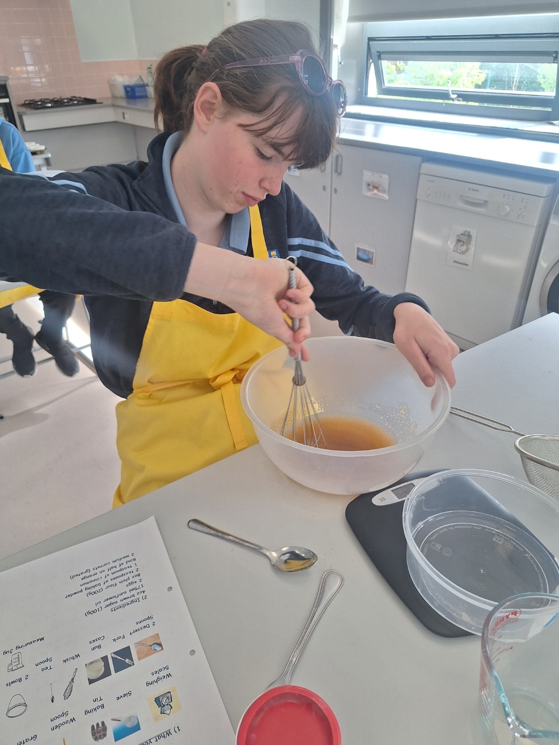 Nakita is mixing up the oil and brown sugar for her carrot and orange muffins.