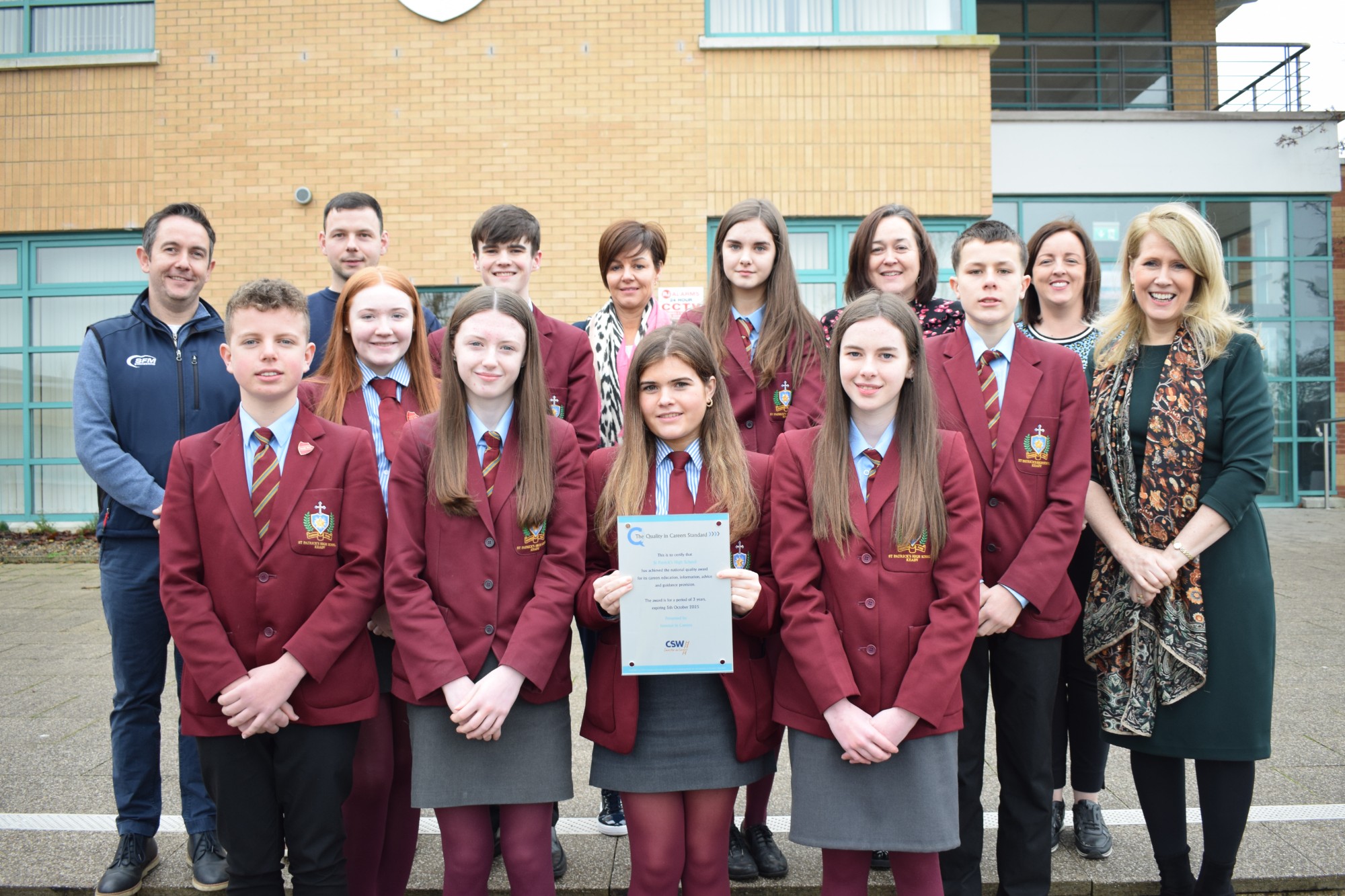 Celebrating the achievement of the IIC Award are: School Principal Dr Moore, Head of Careers Mrs Margaret Traynor, SFM Engineering representatives Mr Breen and Mr Renaghan and pupils from across Key Stages 3, 4 and 5. 