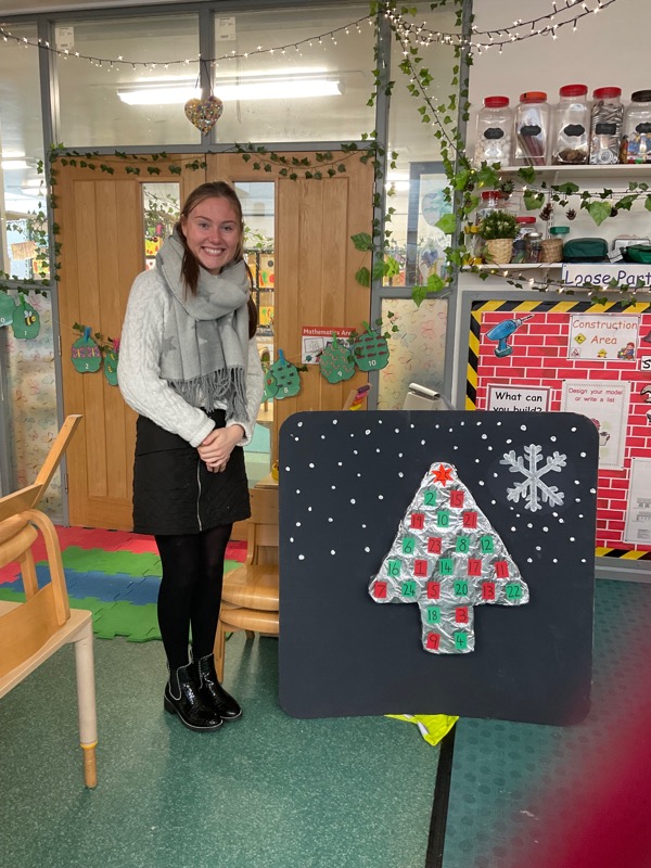 Abigail presenting the class with their advent calendar.