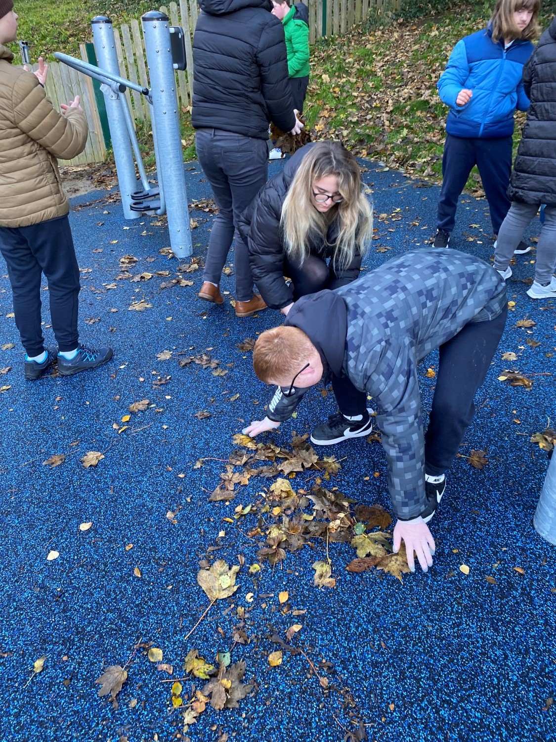 Students helping to keep our school clean and safe.