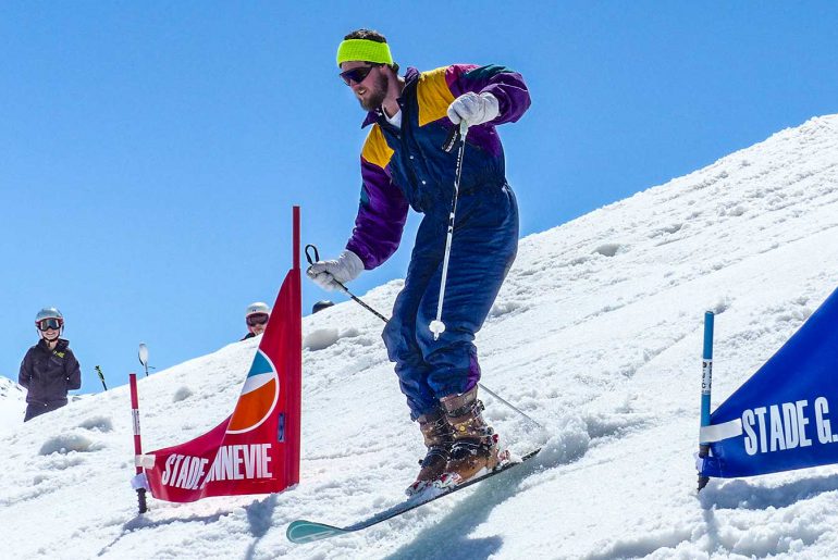 Man in retro ski clothing in monoski championship race