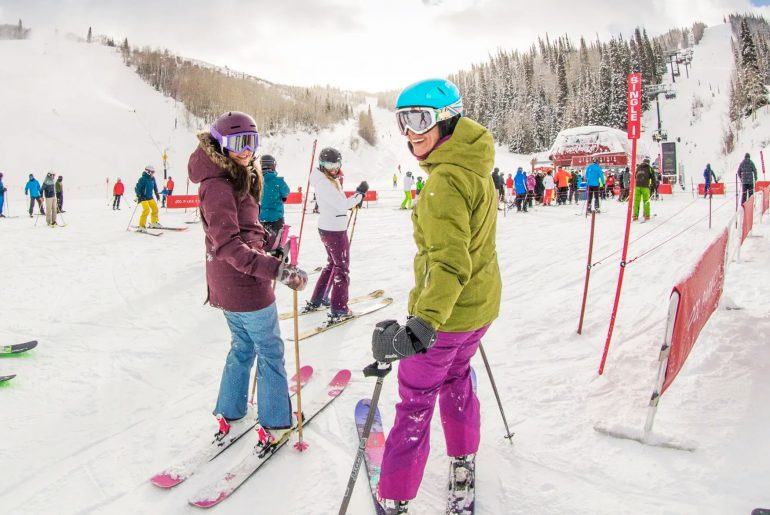 group of friends skiing look to camera