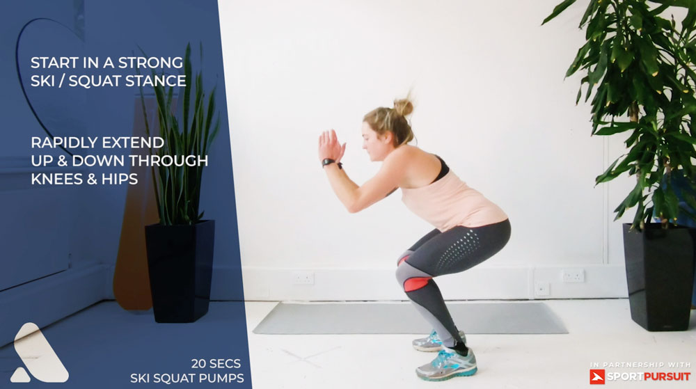 woman doing pre-ski workout for leg strength - ski squats pumps