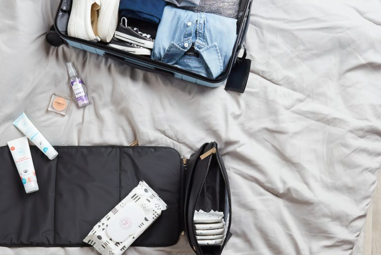 toiletries being packed in suitcase