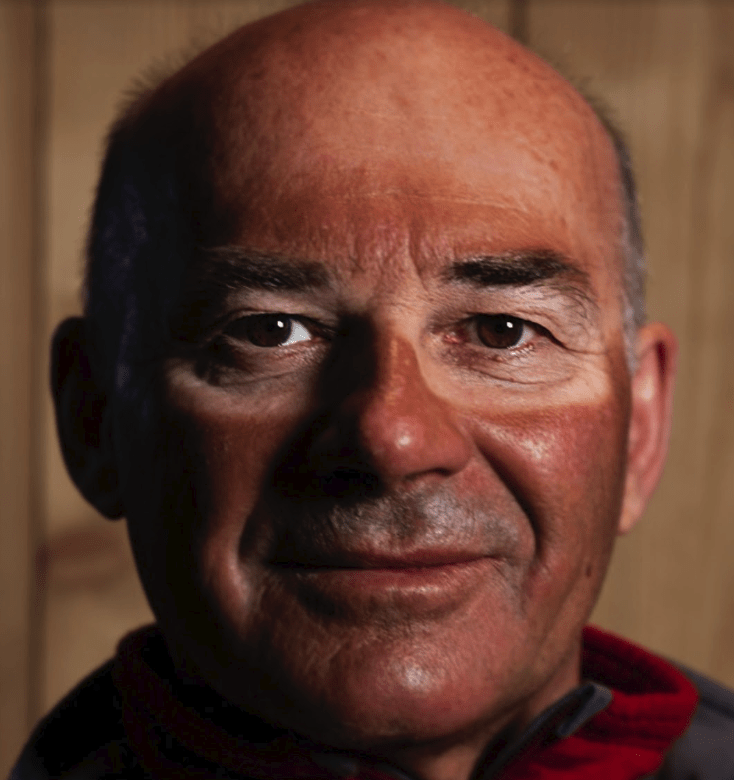 Portrait of a man with severe sunglasses and goggle tan