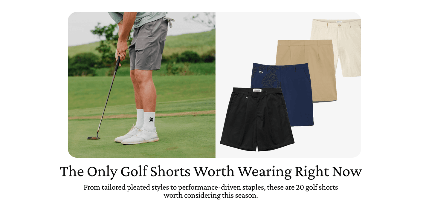Golfer putting on a green, next to folded black, navy, and beige golf shorts.