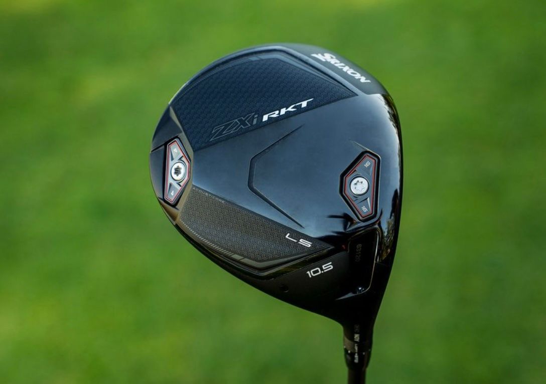 Modern black golf driver with 'PRO V' marking, resting on vibrant green grass.