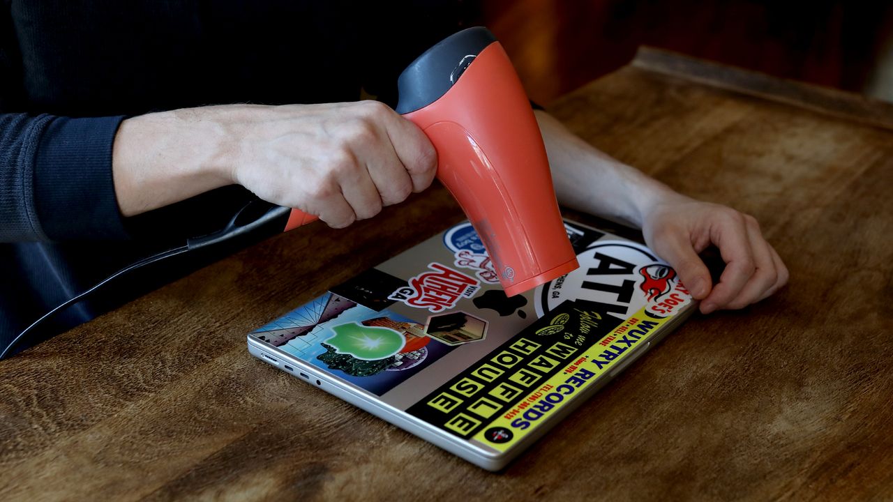 loosening stickers with a hair dryer