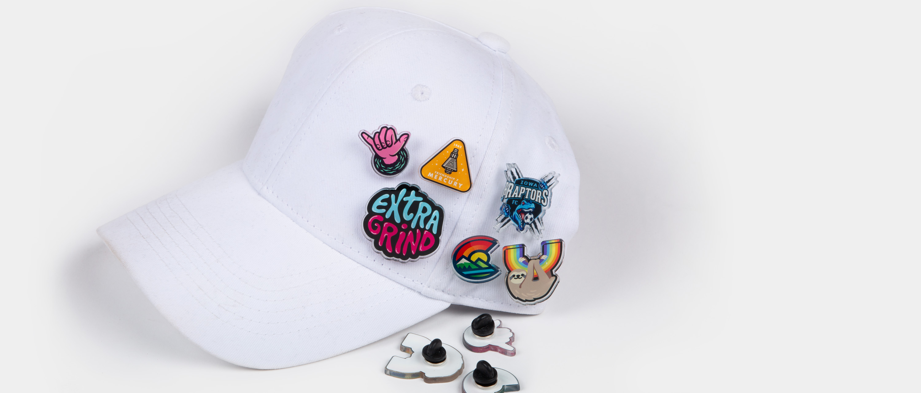 Custom hat pins on a white cap