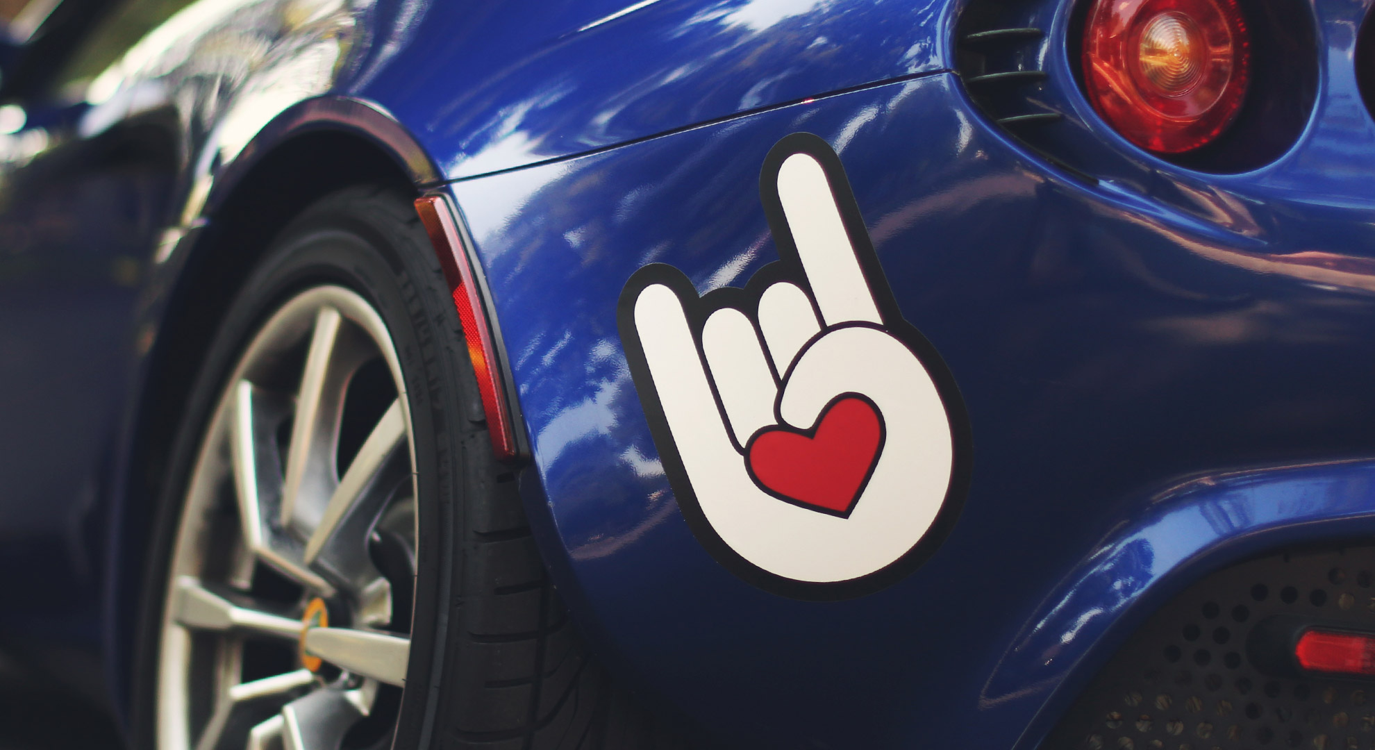 Custom bumper sticker on rear of car