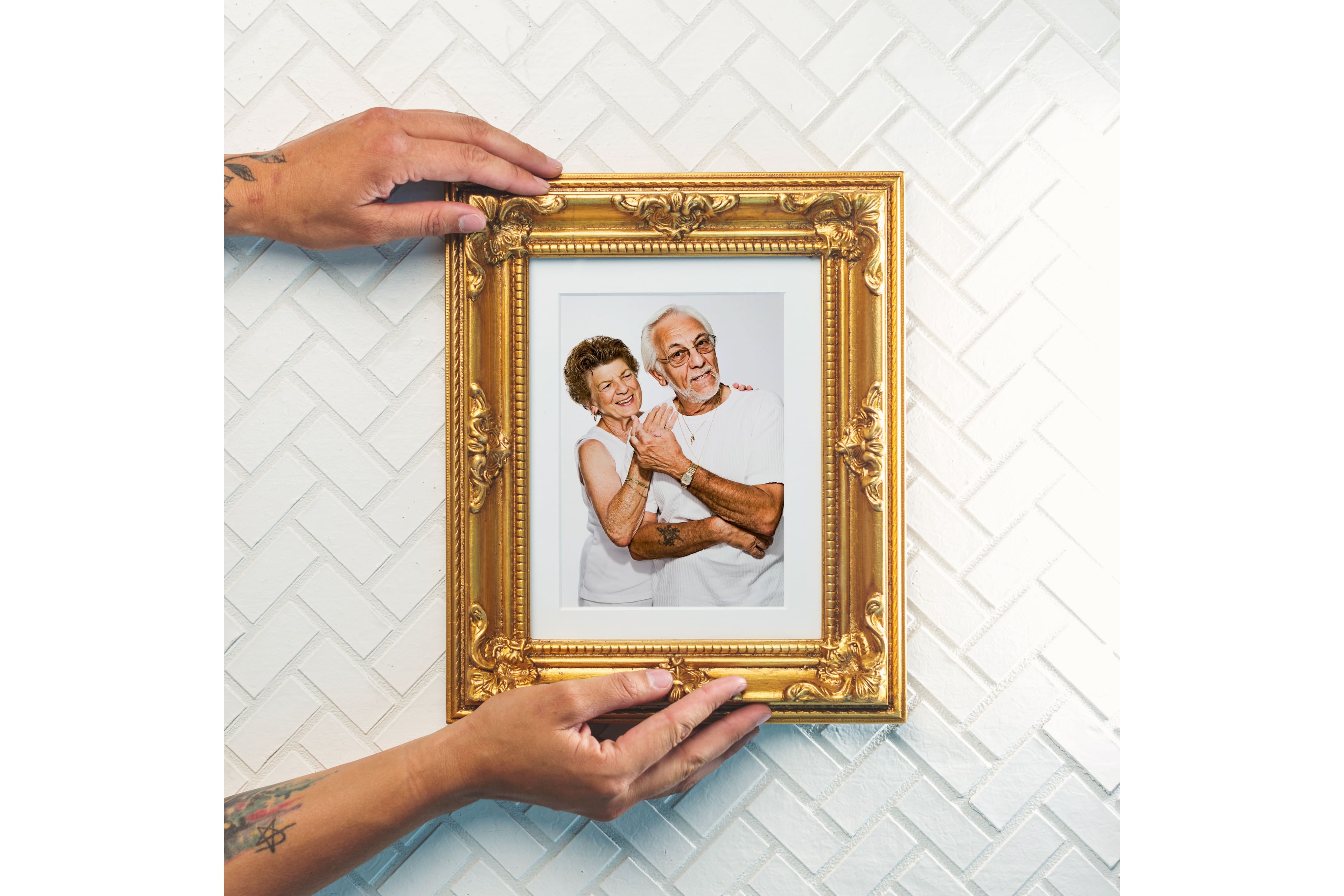 Framed photo in gold frame on wall