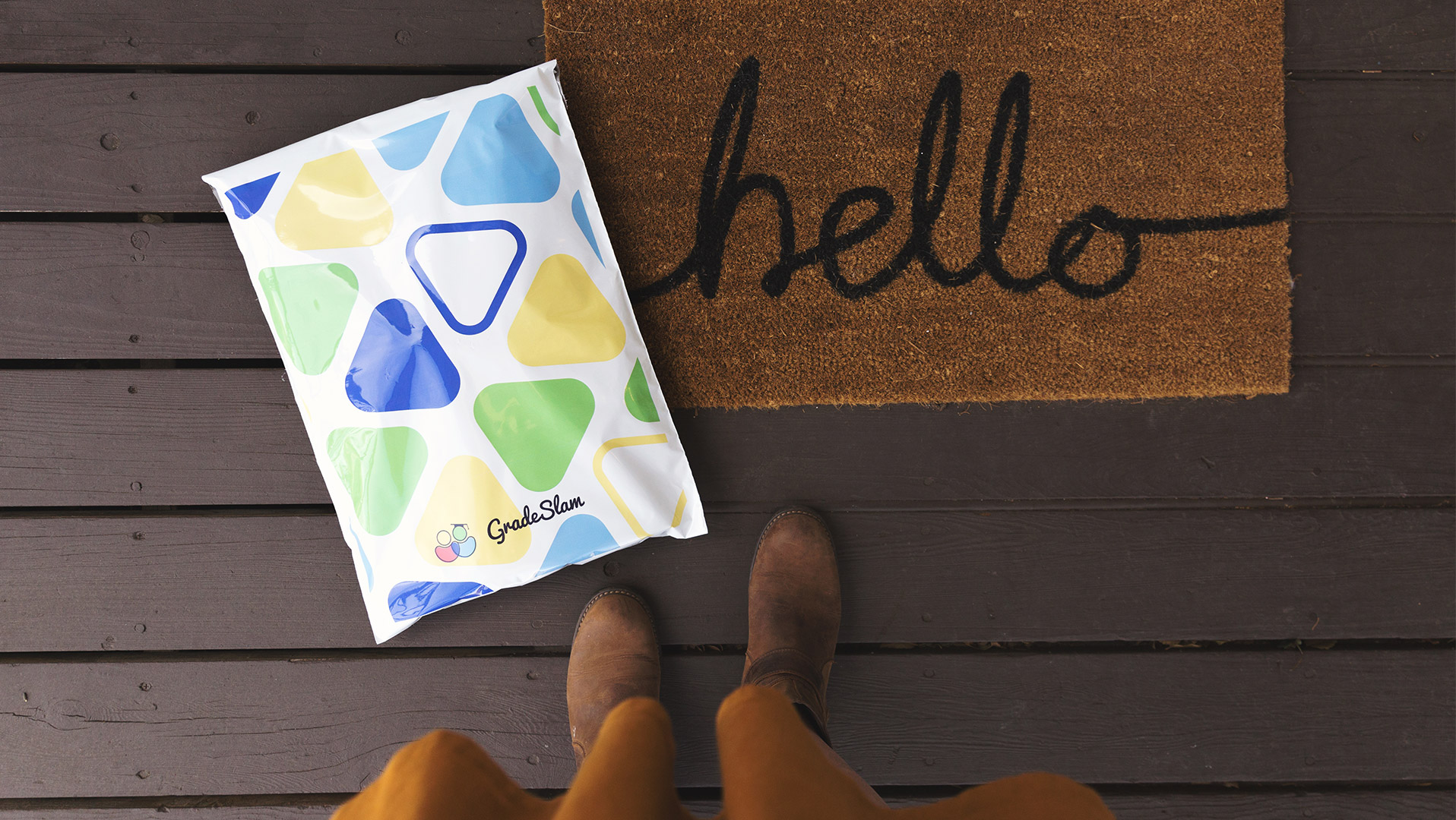 Poly mailer shipping bag beside welcome mat